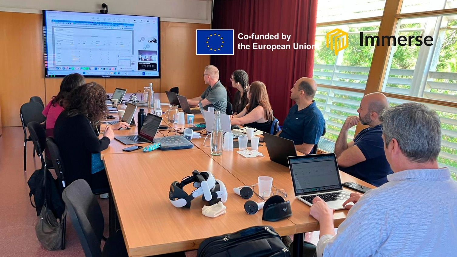 IMMERSE project partners meeting around a conference table in Barcelona